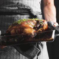 close-up-hands-holding-tray-with-turkey.jpg